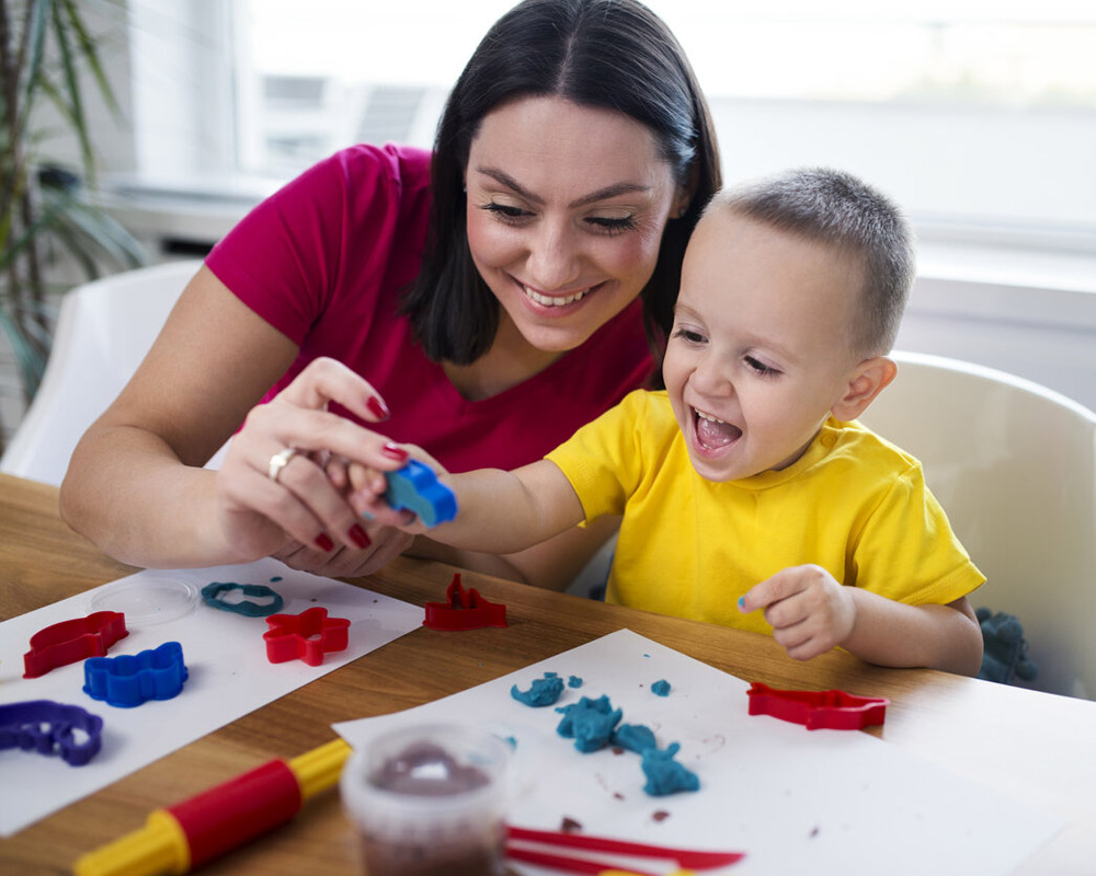 Mom and son with clay dough